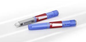 Two tirzepatide injectors beside one another. A healthcare professional can explain how much tirzepatide costs.