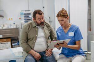 A female doctor speaks with an overweight male patient and explains if tirzepatide is safe and what to know before starting.